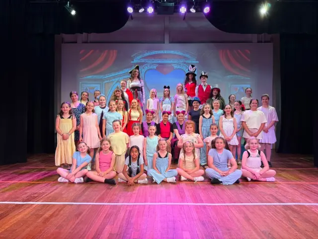 The Born To Be company on stage after a show