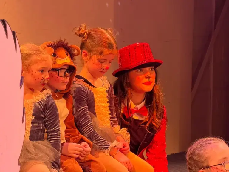 Students in costume mid-scene
