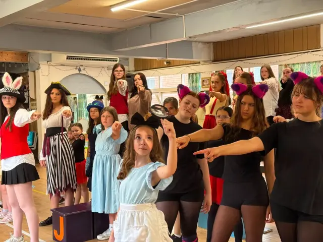 A costumed group rehearsal in the studio